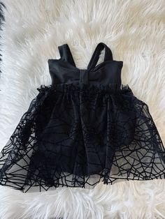 This super cute bow front tool dress. That ties in the back is perfect for the Halloween season. It is made from a DBP fabric, which makes it soft and stretchy. The black tulle has a spiderweb print that is velvet and has silver glitter. Sizing:  Newborn-babies height, 33 inches.  3 months - babies height, 35 inches. 6 months - babies height, 37 inches. 9 months- babies height, 39 inches. 12 months - babies height 41 inches. 18 months - babies height, 43 inches.  2t- babies height, 45 inches. 3t- babies height, 47 inches. Care info:  Please make sure to hand wash and hang dry. This will ensure that the tulle will last longer and not rip. Goth Baby Aesthetic, Emo Baby Clothes, Goth Pregnancy Outfits, Goth Baby Nursery, Gothic Baby Nursery, Gothic Baby Clothes, Alternative Baby Clothes, Goth Baby Clothes, Tool Dress