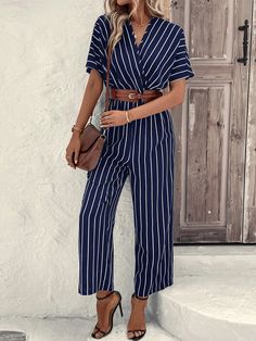 This stylish Striped Print Batwing Sleeve Jumpsuit is perfect for a day out. Featuring a wrap design and long length, it has a striped pattern in blue color that will add a touch of fun to any outfit. With a V-neck, short fluttery batwing sleeves, and a regular fit, this shirt is sure to be a staple in your wardrobe. Specifications: Style: Casual Pattern Type: Striped Details: Wrap Length: Long Type: Shirt Fit Type: Regular Fit Neckline: V neck Sleeve Length: Short Sleeve Sleeve Type: Batwing Sleeve Waist Line: High Waist Fabric: Non-Stretch Material: Woven Fabric Composition: 100% Polyester Care Instructions: Machine wash or professional dry clean Size Chart(cm): Size US Bust Cuff Hip Size Inseam Length Sleeve Length Thigh Waist Size S 4 90 34.5 105 62.5 139 37 67 64-98 M 6 94 35.9 109 63 Striped V-neck Jumpsuits And Rompers For Summer, Striped Jumpsuits For Spring Day Out, Trendy Striped Jumpsuits And Rompers For Beach, Chic Striped Jumpsuits And Rompers For Beach, Chic Fitted Jumpsuits And Rompers With Vertical Stripes, Striped Short Sleeve Jumpsuits And Rompers For Summer, Casual Striped Jumpsuits And Rompers For Summer, Casual Striped Jumpsuits And Rompers For Day Out, Trendy Striped Jumpsuits And Rompers For Vacation