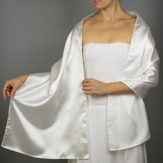 A very elegant satin shawl wrap shrug for your wedding , party or evening dress Color: ivory ( also available in white or black ) Size : 160 cm x 40 cm You can use it as a wrap, shawl or stola. You can find a matching sating bridal purse / bag in our Etsy shop or just contact us. We accept credit cards. Elegant Cream Shawl For Evening, Elegant Fitted White Shawl, Elegant White Shrug For Formal Occasions, Elegant White Evening Shawl, Elegant White Formal Shrug, Fitted Wedding Shawl Wrap, Cream Silk Shawl For Wedding, Cream Shawl For Evening, Elegant Wedding Wrap