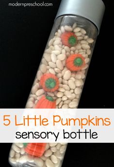 a bottle filled with lots of white and orange food next to a black background that says, 5 little pumpkins sensory bottle