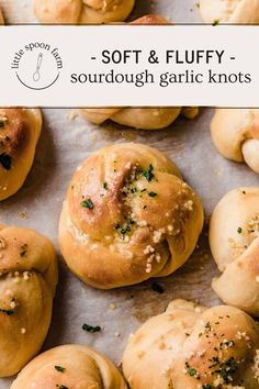 soft and fluffy sourdough garlic knots on a baking sheet with text overlay