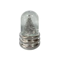 a snow globe with a christmas tree in it on top of a silver base and glass dome