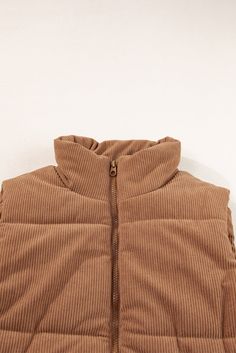 Stay warm and stylish with our Light Brown Corduroy Puffer Vest. Featuring a stand up collar and zippered design, this vest is perfect for layering and adding texture to your outfit. Keep it casual or dress it up, either way, you'll stay cozy and on-trend. Size Chart (INCH) Sizes US Sizes Euro Sizes UK Sizes Bust Hem_Width Shoulder Length Relax Relax Relax Relax S 4-6 34-36 8-10 43.3 43.7 16.7 23.6 M 8-10 38-40 12-14 45.7 46.1 17.3 24.4 L 12-14 42-44 16-18 48.0 48.4 17.9 25.2 XL 16-18 46-48 20-2 Corduroy Puffer, Corduroy Vest, Stand Neck, Almost Ready, Mini Robes, Vest Coat, Socks And Sandals, Short En Jean, Sleeveless Vest