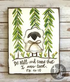 a painting on the wall with a sheep and pine trees behind it that says, be still and know that i am god