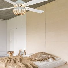 a bedroom with a bed and ceiling fan