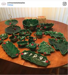 a wooden table topped with lots of green dishes