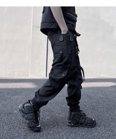 Pant type: looseStyle: overallsBelt: Yeswaist type: middle-waisted Black Tactical Parachute Pants With Pockets, Black Cyberpunk Cargo Pants With Multiple Pockets, Black Cargo Style Techwear Parachute Pants, Black Techwear Parachute Pants With Cargo Style, Black Cargo Style Parachute Pants, Baggy Black Combat Cargo Pants, Techwear Cargo Jeans For Streetwear, Black Tactical Bottoms For Streetwear, Tactical Cargo Jeans For Streetwear