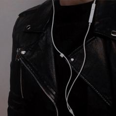 a man wearing headphones and a black jacket