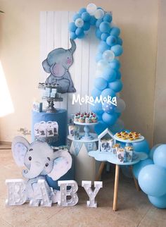 an elephant themed baby shower with blue balloons