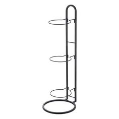 a metal rack with three circular shelves and two circles on the bottom one shelf is black