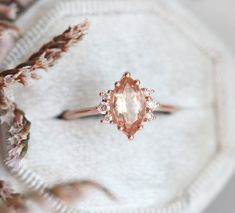 A sparkling peach marquise morganite and diamond ring in 14k or 18k gold, pictured in rose gold. This ring features a high quality sparkly peach morganite. The design can be made with gemstones of your choosing. If you would prefer a custom ring, please contact us before purchase. Details Main stone Gemstone: peach morganite, if you want pink morganite please write in the notes - with pink morgaite Cut: marquise Measurements: approx. 10x5mm Side stones Gemstone: white diamonds Shape: round Measu Peach Morganite Engagement Ring, Marquise Engagement Ring, Morganite Diamond Ring, Peach Morganite, Morganite Diamond, Engagement Rings Marquise, Morganite Engagement, Pink Morganite, Morganite Engagement Ring