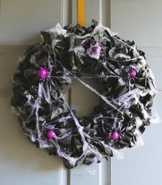 a halloween wreath hanging on the front door