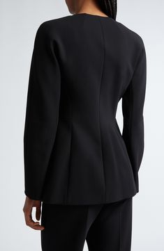 A hidden-button placket underscores the clean-lined aesthetic of this collarless jacket tailored in a cutaway silhouette from stretch-enhanced jersey. Hidden-button placket Jewel neck Front welt pockets Lined 78% viscose, 16% polyamide, 6% elastane Dry clean Made in Italy Designer Clothing Modern Long Sleeve Blazer With Structured Boning, Modern Blazer With Structured Boning And Long Sleeves, Sleek Structured Blazer With Boning, Sleek Structured Suits With Concealed Placket, Sleek Structured Suit With Concealed Placket, Sleek Tailored Blazer With Structured Boning, Sleek Blazer With Structured Boning For Work, Classic Blazer With Structured Shoulders, Elegant Outerwear With Structured Shoulders For Office