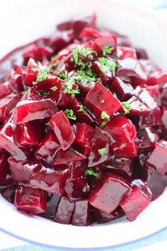 a white bowl filled with beets and parsley