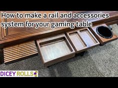 a wooden table with two trays on it and a quote about how to make a rail and accessories system for your gaming table