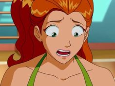 an animated woman with red hair and green bra