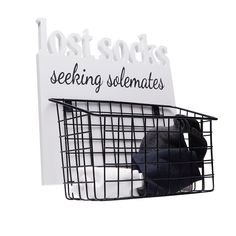 a sign that says lost socks, seeking selenates and sitting in a basket