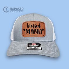 The perfect hat to honor our mothers! Blessed Mama. High quality engraved leather patch trucker hat. Richardson 112: Fabric: Cotton-Poly/Nylon Mesh Visor: Pre-curved Sweatband: Cotton Fit: Adjustable Snapback Size: One Size Fits Most Adjustable Gray Hat For Gift, Leather Patch Cap Hat Gift, Leather Patch Cap - Gift, Leather Patch Cap As Gift, Leather Patch Cap As A Gift, Brown Baseball Cap As Gift, Adjustable Hats With Leather Patch As Gift, Brown Flat Bill Trucker Hat For Gift, Brown Flat Bill Trucker Hat As Gift