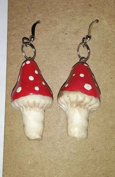 pair of red and white mushroom shaped earrings