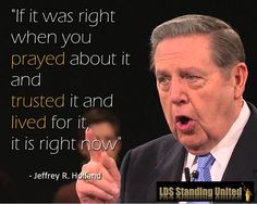 a man in a suit and tie making a speech with a quote on the background