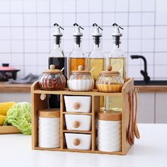 an assortment of spices and condiments on a kitchen counter