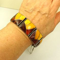 BOLD AMBER BRACELET Set In 925 Silver - Butterscotch Cognac Inlay Amber Bracelet - Hinged Style - Rare Heavy Vintage - Unisex Jewelry Gift. Inlay amber bracelet, Hinged Cuff Style, Heavyweight Jewelry, Chunky bracelet, Amber Gift For Him, Perfect Gift For Her, Vintage Beauty With Designer Touch. MODERNIST BRACELET. AMAZING heavy 60g bracelet from Modernist Polish designer. Unisex bracelet. Measurements: Length 8". Comfortable fit to the wrist 7.5" around.  1" wide. Hinged cuff with secured closu Vintage Amber Jewelry, Amber Bracelet, Chunky Bracelets, Natural Amber, Unisex Bracelets, Amber Jewelry, Unisex Jewelry, Perfect Gift For Her, Quality Jewelry