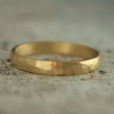 3mm Gold Hammered Ring 18K Gold Hammered Band Half Round Ring Gold Wedding Band Rustic Gold Wedding Ring Hammered Matte Ring Men's Women's A lovely weight band, it begins with 3mm wide by 1.5mm thick solid 18K gold stock. Your ring is hand forged to size just for you and given a hand hammered surface texture. It is then softly brushed for a matte look. Blazer Arts is a family-owned and operated small but growing business that first opened up shop on Etsy in 2008. We now have multiple Etsy shops. Adjustable Hammered Stackable Wedding Rings, Gold Engraved Ring With Simple Design For Wedding, Simple Design Gold Engraved Ring For Wedding, Simple Gold Engraved Wedding Ring, Hammered 14k Gold Wedding Rings, Wedding Bands With Hammered Round Shape, 14k Gold Hammered Wedding Rings, Gold Hammered Stackable Wedding Rings, Gold Hammered Stackable Rings For Wedding