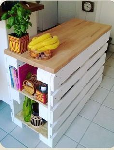 a kitchen island made out of pallets with bananas on top and other food items