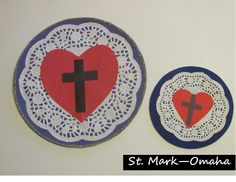 two paper plates with cross and heart on them