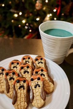 some kind of waffles with chocolate drizzled on them next to a cup of coffee