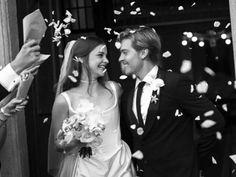 a bride and groom are surrounded by confetti