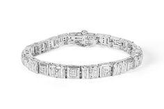 Round and baguette cut diamonds shimmer against a white gold finish on this exquisite two-carat diamond bracelet. Each square link comes together, creating a unique geometric design sure to dazzle her. Formal Diamond Bracelet With Baguette Diamonds, Elegant Rectangular Tennis Bracelet With Baguette Diamonds, Rectangular Diamond Tennis Bracelet With Accents, Wedding Diamond Bracelet With Rectangular Diamond Accents, Rectangular Diamond Accent Bracelet For Wedding, Wedding Diamond Bracelet With Rectangular Accents, Rectangular White Gold Diamond Bracelet, Silver Diamond Bracelet With Baguette Diamonds, Modern Diamond Bracelet With Baguette Cut Accents