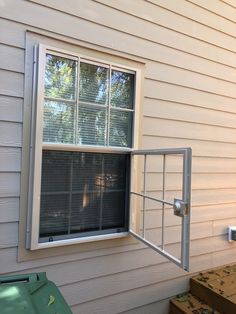 an open window on the side of a house