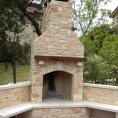 an outdoor fireplace built into the side of a building