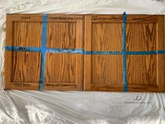 wood paneling with blue tape taped around them on top of a sheet of white paper