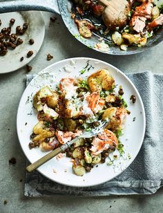 two plates filled with food on top of a table