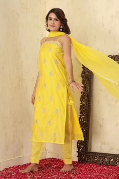 This is a 3-piece set. The set consists of zari embroidered & motif all over on kurta with side tassels has square neck, shoulder strap sleeves, calf length teamed with trouser pants and a dupatta. 3-piece set Color-Yellow Fabric-Silk Kurta Length-Calf Length Sleeves-Sleeveless Neck-Sqare Neck Work-Embroidery done with zari detailing & motif work all over with side Tassels. Washing Care-Wash Separately Festive Summer Straight Kurta Pant Set, Designer Anarkali Sets For Summer, Anarkali Designer Wear Sets For Summer, Summer Anarkali Designer Wear Sets, Summer Pant Set With Dupatta And Straight Kurta, Summer Pant Set With Straight Kurta And Dupatta, Traditional Drape Sets With Dupatta For Summer, Summer Straight Kurta Pant Set With Resham Embroidery, Spring Anarkali Sets With Mirror Work