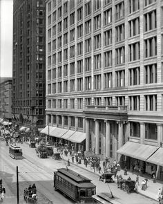 an old black and white photo of a city street