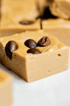 pieces of peanut butter fudge cake sitting on top of each other with chocolate chips