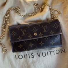 Reposhing This Authentic Louis Vuitton Wallet Never Used It Myself. Condition Is Still The Same As Photos Shown, There Are Some Minor Flaws See All Photos. Will Include The Non Lv Gold Chain - No Dust Bag 1st Photo Is Mine - The Remaining Are The Reposh Photos Elegant Bags In Monogram Canvas With Card Slots, Elegant Monogram Canvas Bags With Card Slots, Luxury Wallet On Chain For Daily Use, Luxury Monogram Canvas Bag With Card Slots, Elegant Monogram Canvas Bag With Card Slots, Luxury Monogram Canvas Wallets For Everyday Use, Elegant Monogram Canvas Wallets For Everyday Use, Lv Wallet On Chain Ivy, Louis Vuitton Key Holder