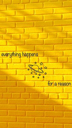 a yellow brick wall with the words everything happens for a reason