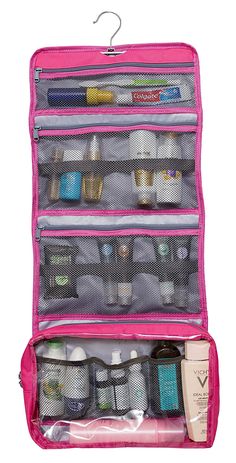 an open pink travel bag filled with personal care items and toiletries on a white background