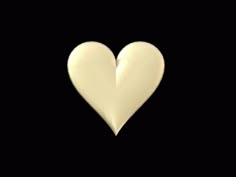 a white heart shaped object on a black background