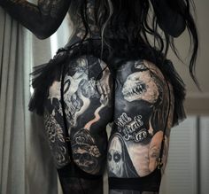 the back of a woman with tattoos on her body