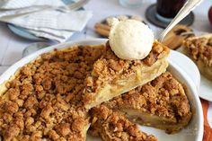 a plate with some pie on it and a scoop of ice cream in the middle