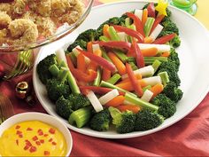 broccoli, carrots, celery and other vegetables on a table