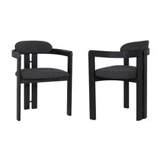 a pair of black chairs sitting next to each other