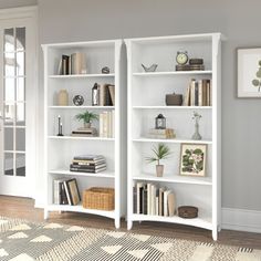 a white bookshelf filled with lots of books