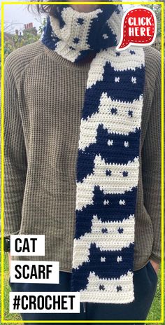 a crocheted scarf with the words cat scarf written in white and blue