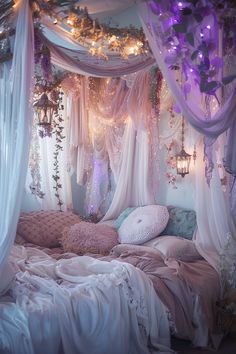 a canopy bed with curtains and lights hanging from the ceiling